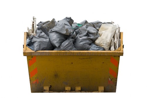 Professionals loading rubbish onto a truck in South London